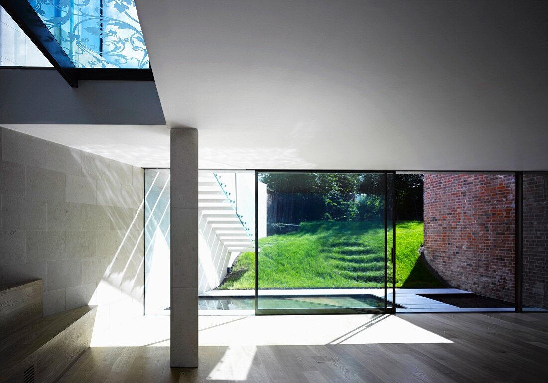 Contemporary architecture - an empty living room with floor-to-ceiling windows