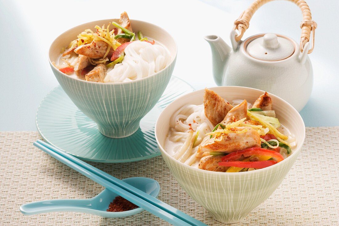 Oriental coconut soup with rice noodles, chicken and vegetables