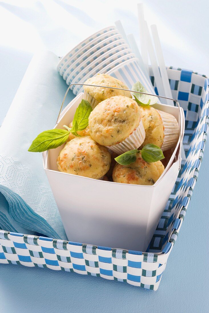 Spicy muffins with basil and paper cups