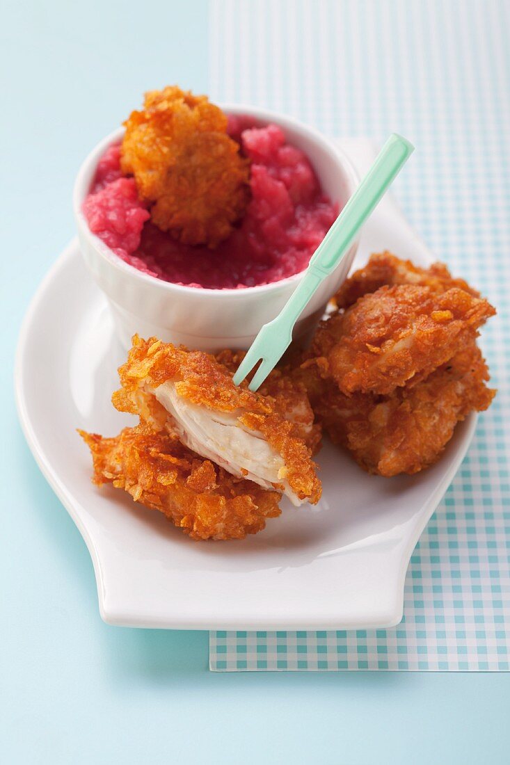 Chicken nuggets and mashed potatoes with beetroot juice