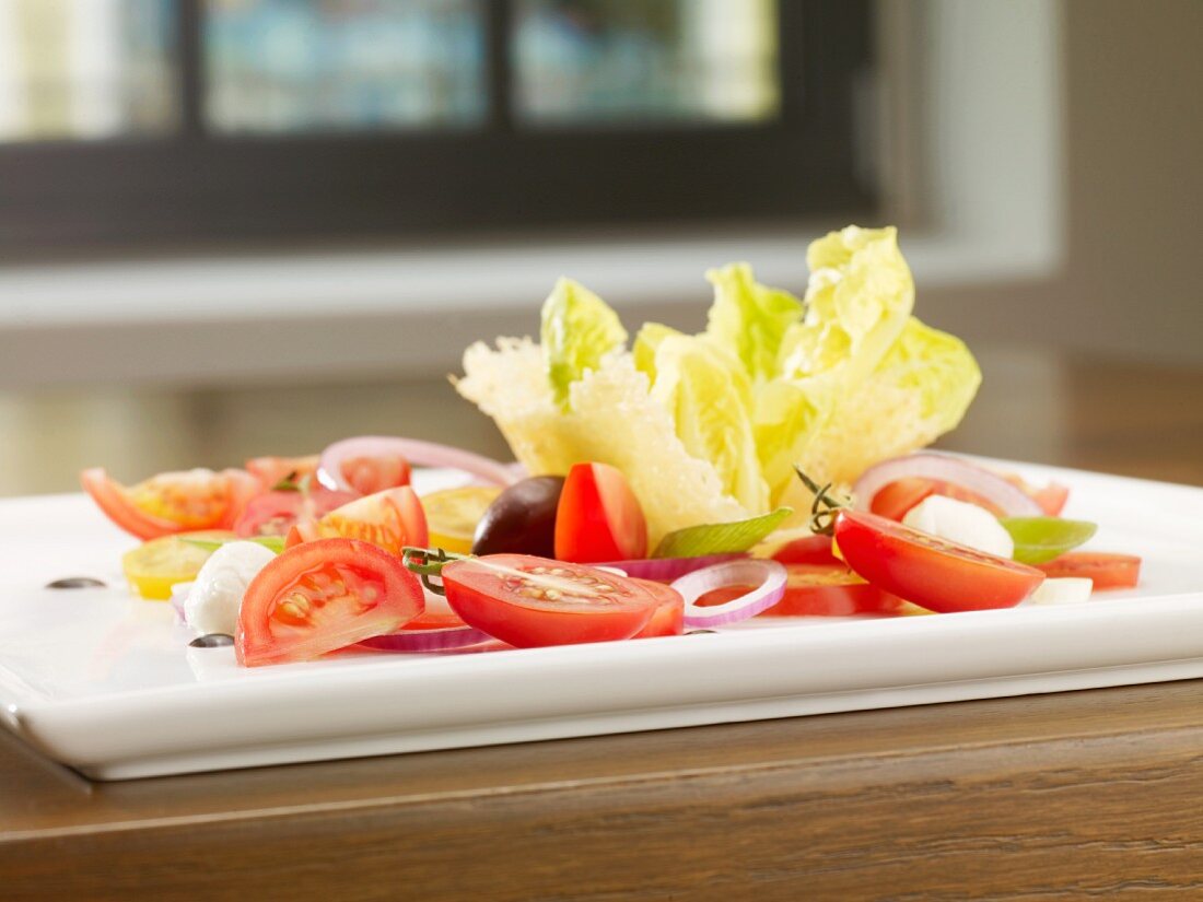 A tomato salad with three different types of tomato