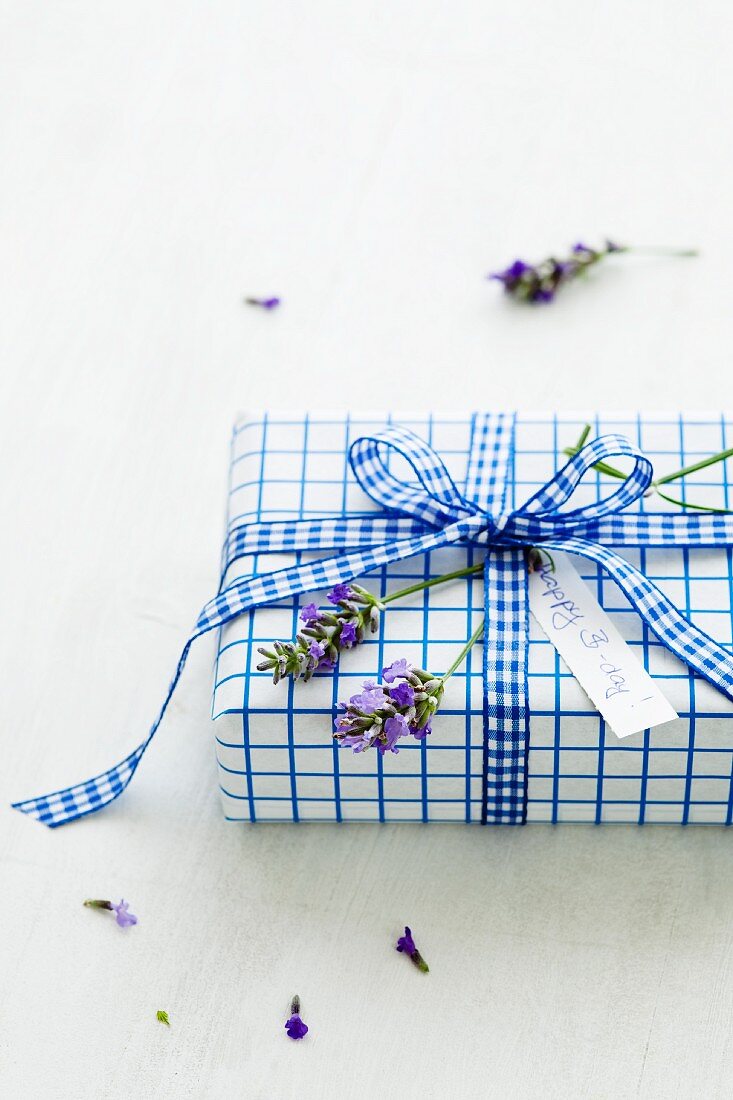 A birthday present decorated with lavender flowers