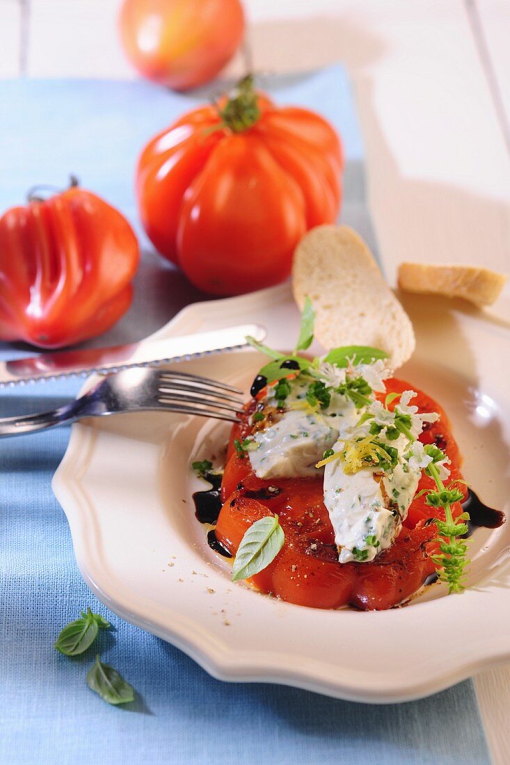 A salad made with roasted tomatoes and creamy goat's cheese