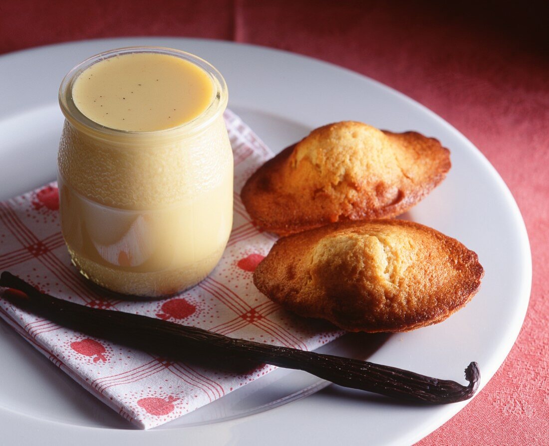 Madeleines with a jar of vanilla cream