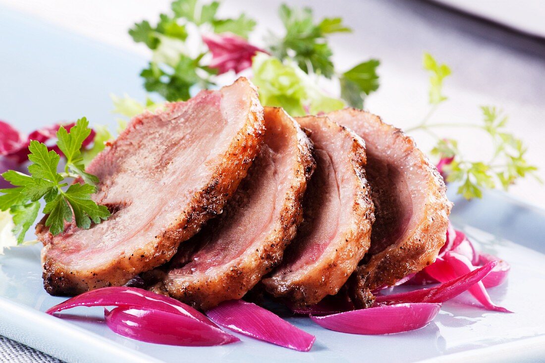 Roast goose with red onions