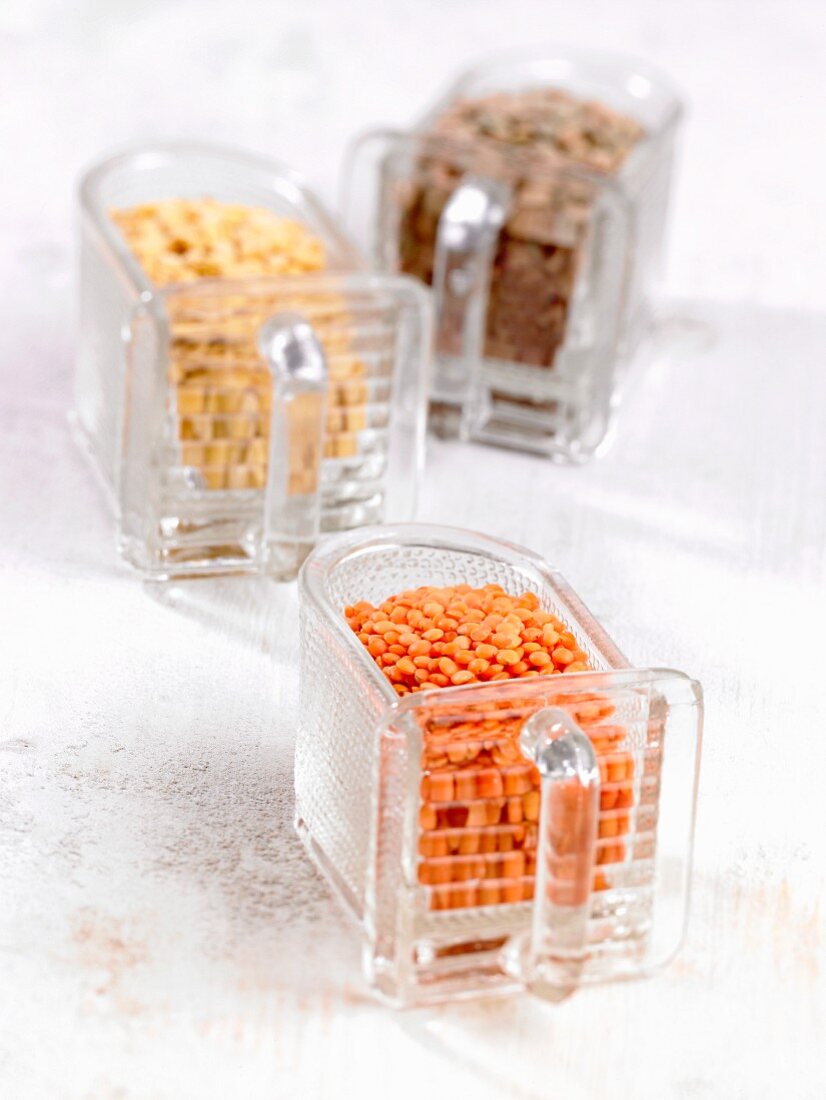 Red, yellow and brown laird lentils in boxes