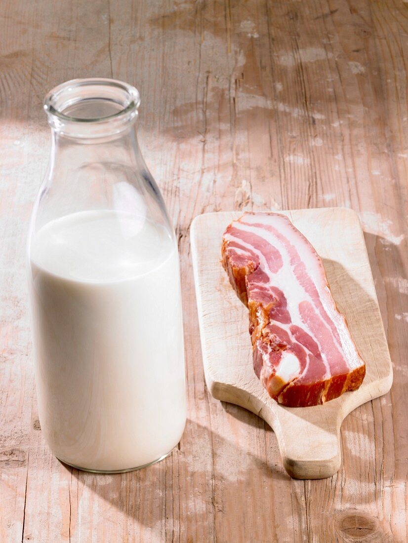 A bottle of milk and bacon