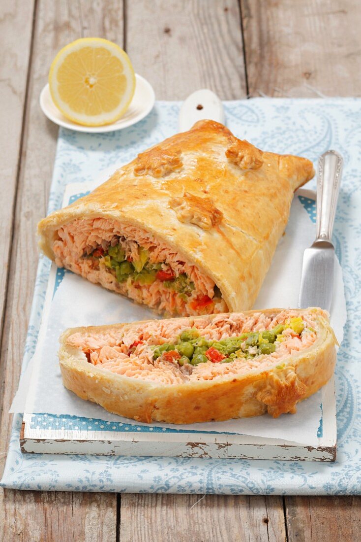 Kulebiak (puff pastry pie, Poland) filled with salmon and peas