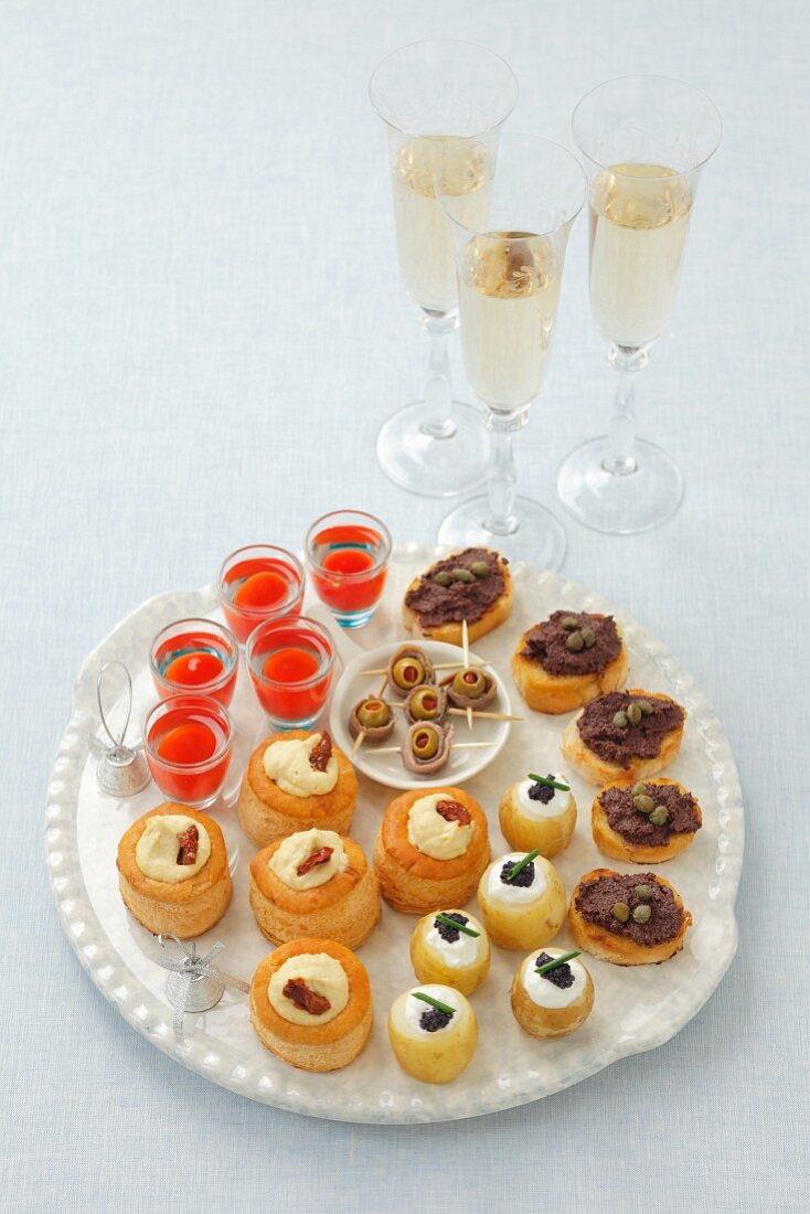 Various canapés and glasses of champagne