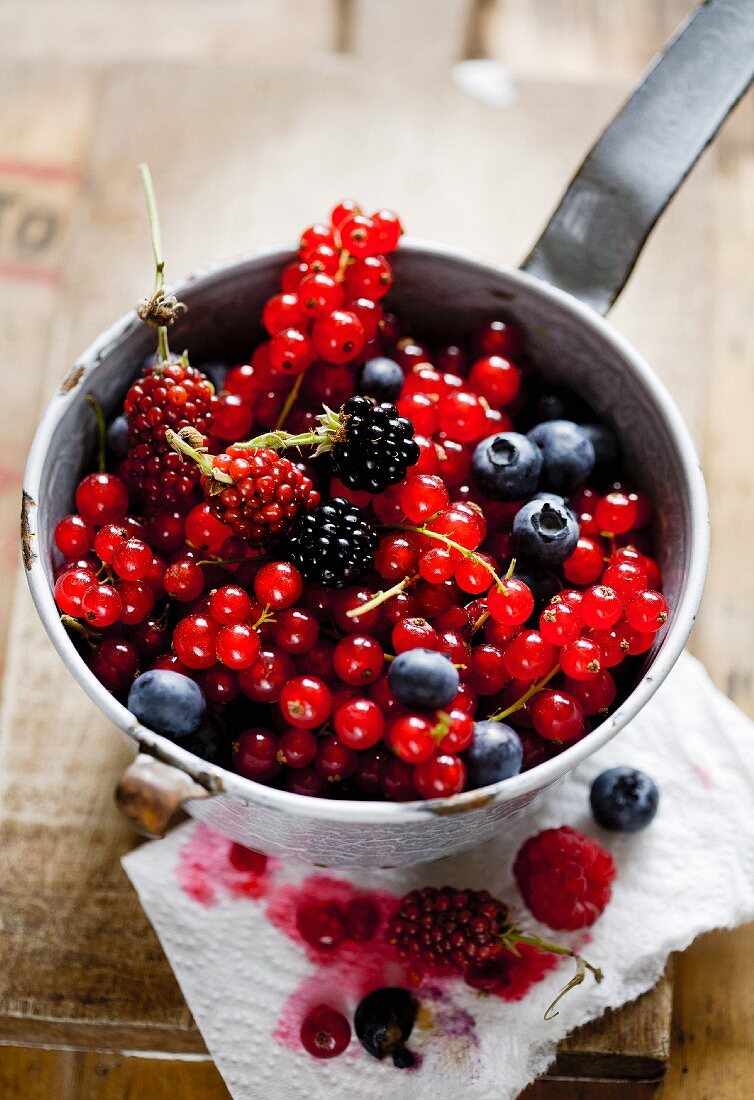 Various berries in a colander