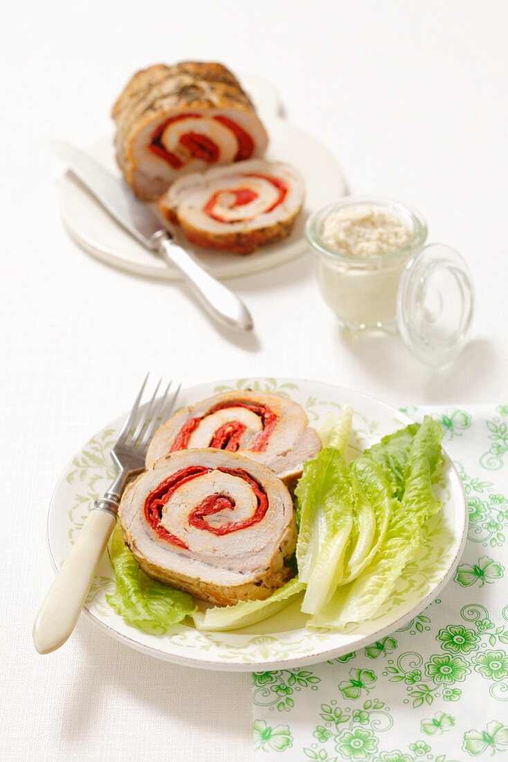 Roast pork roulade filled with peppers