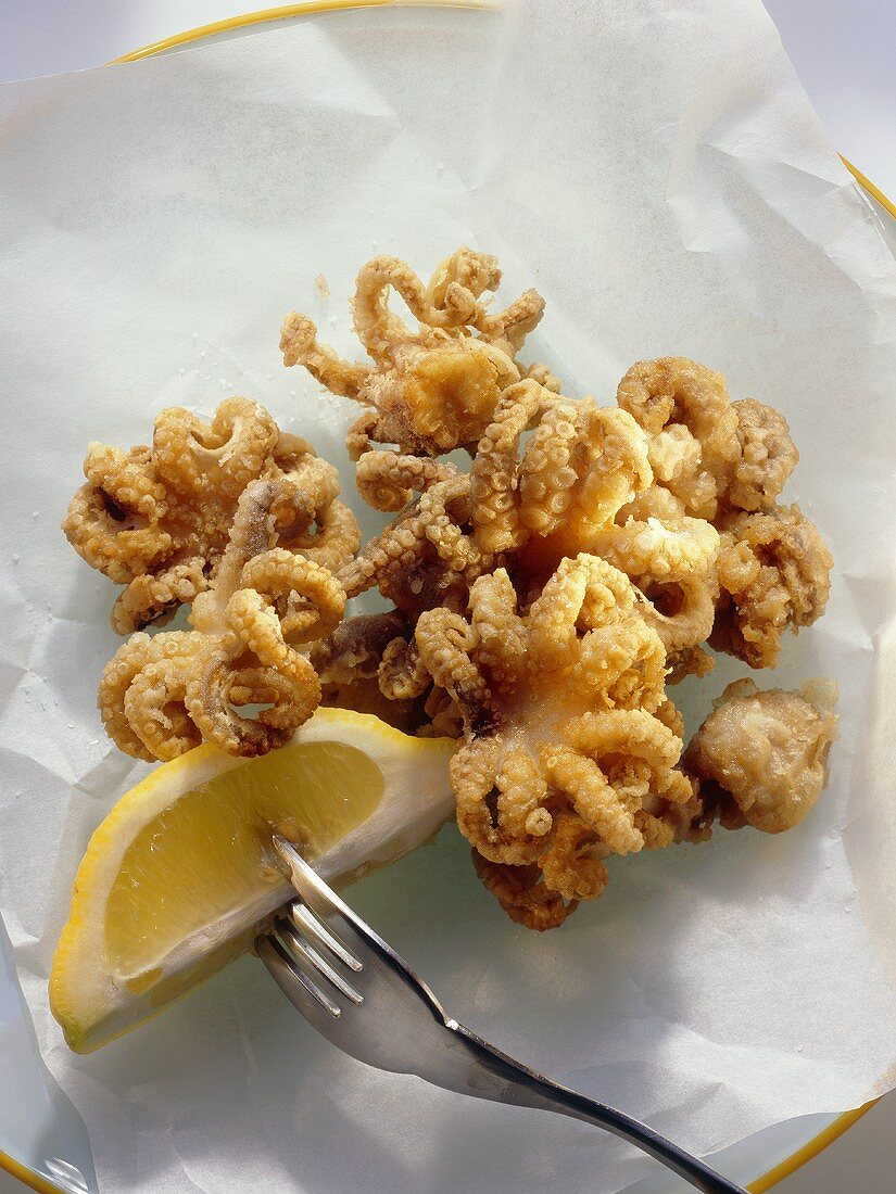 Deep fried squid with lemon wedge