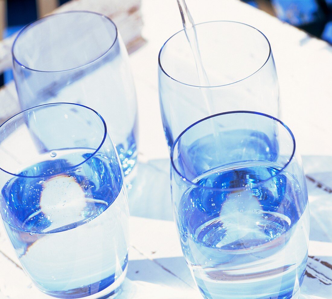 Glasses of water with ice cubes