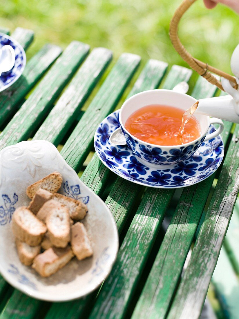 Tea being poured into a cup