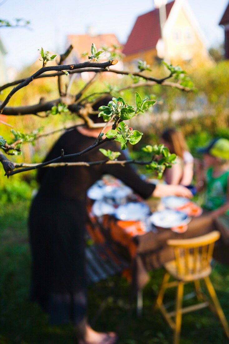 People at a table in a garden