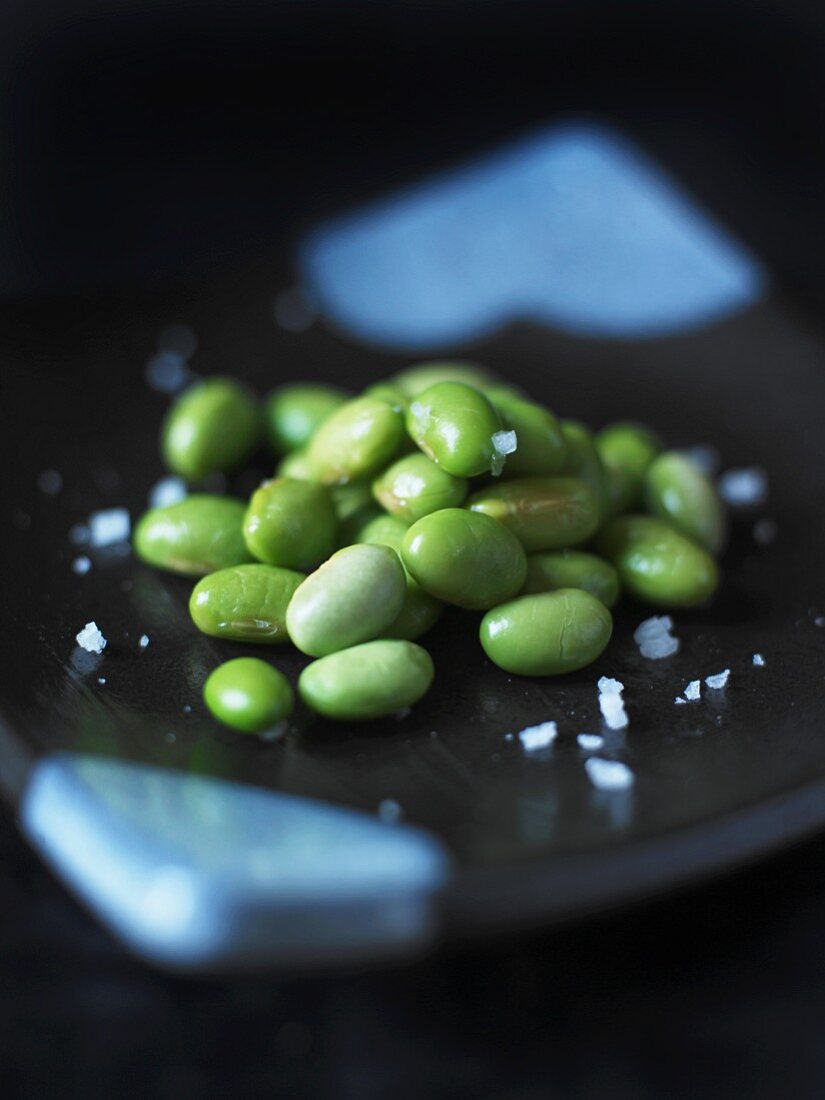 Green beans and salt on a plate