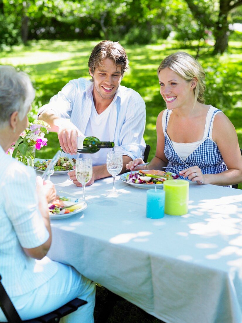 A family eating in a garden