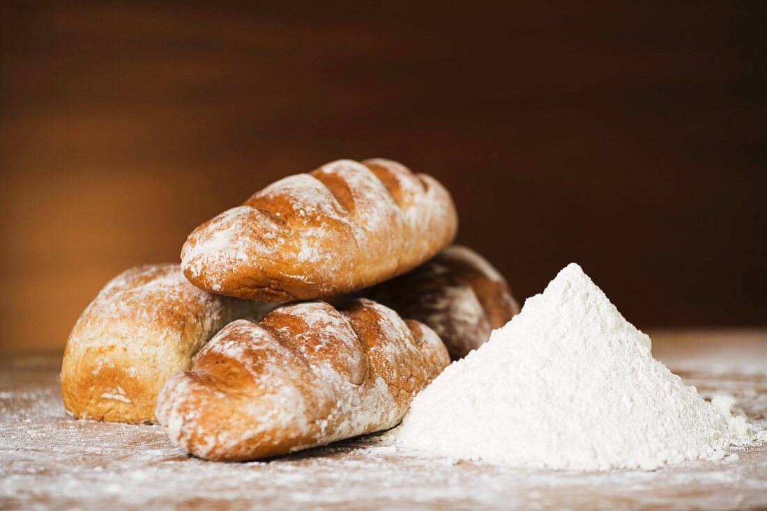 Loaves of bread and a pile of flour