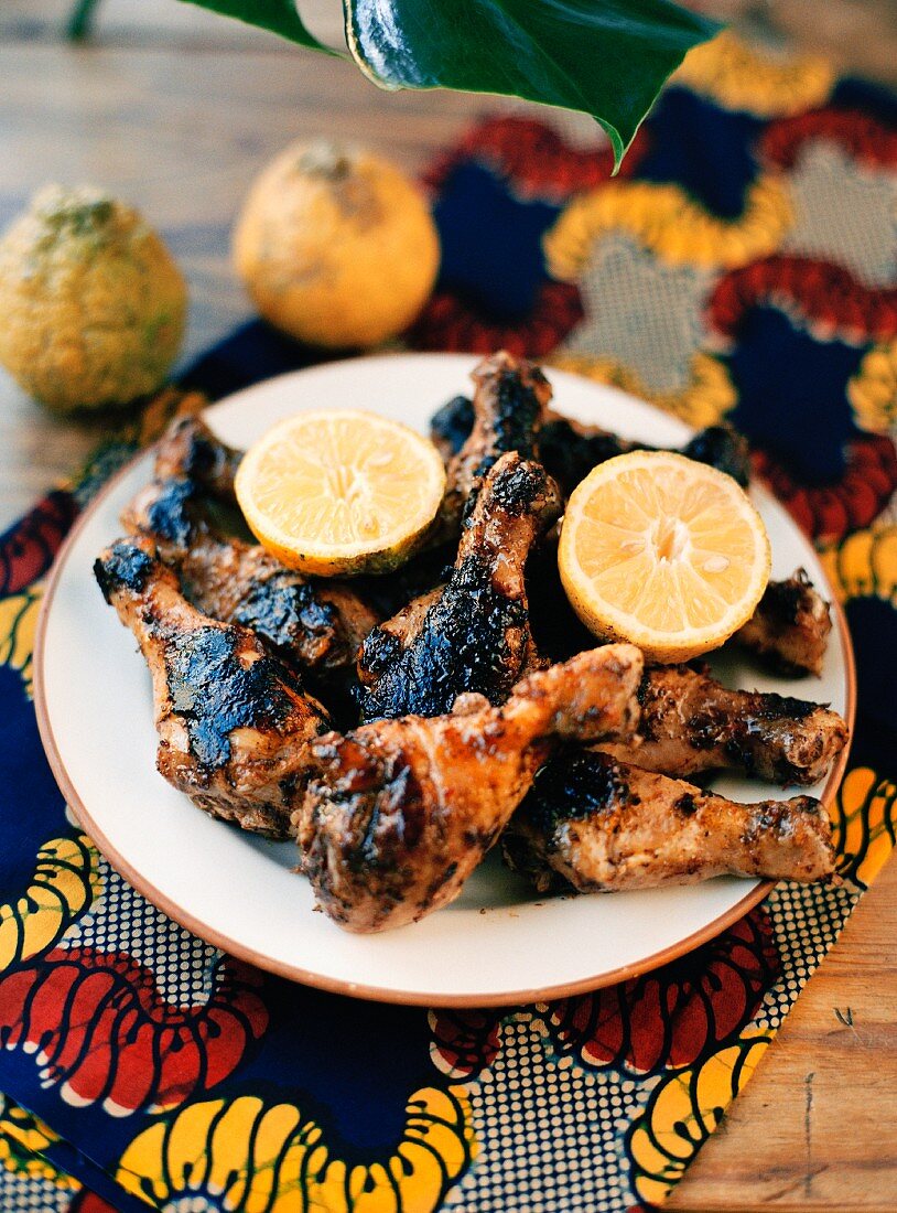 Grilled chicken legs with lemons