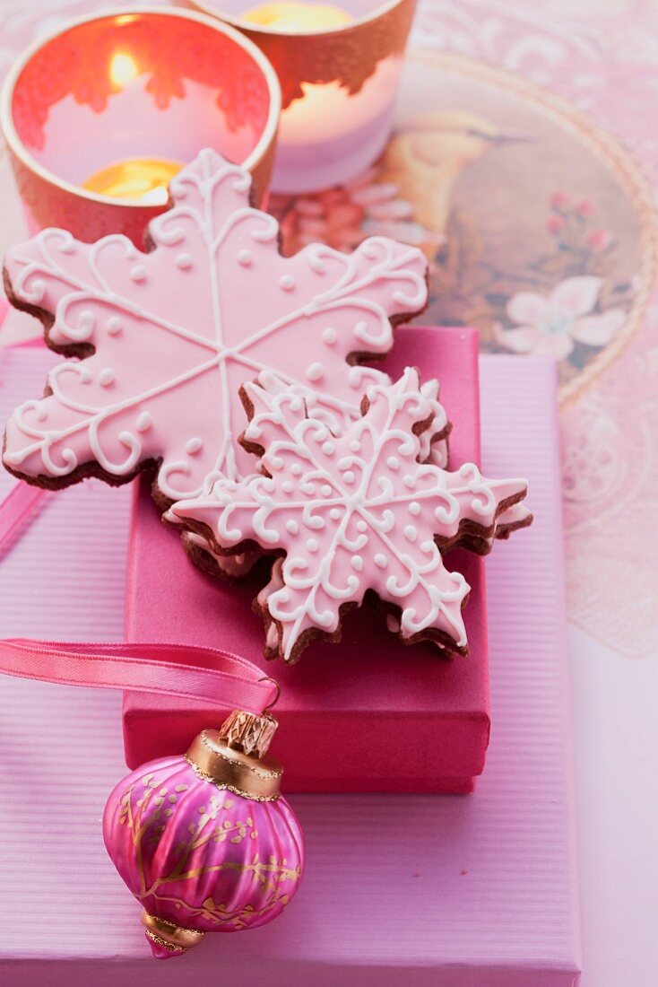 Christmas biscuits decorated with pink icing as a gift