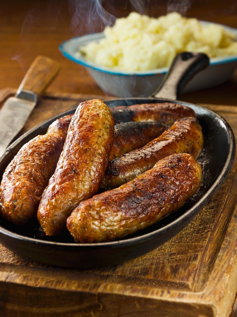 Pork and herb sausages and mashed potato