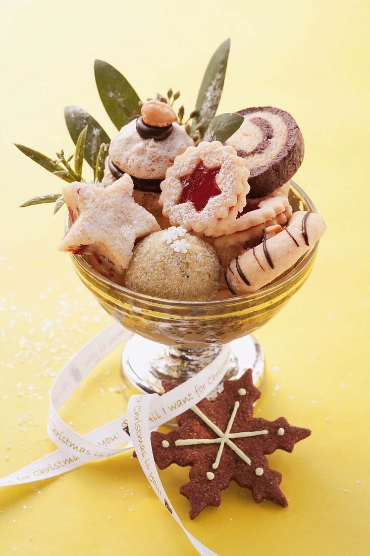 Various Christmas biscuits in a silver bowl