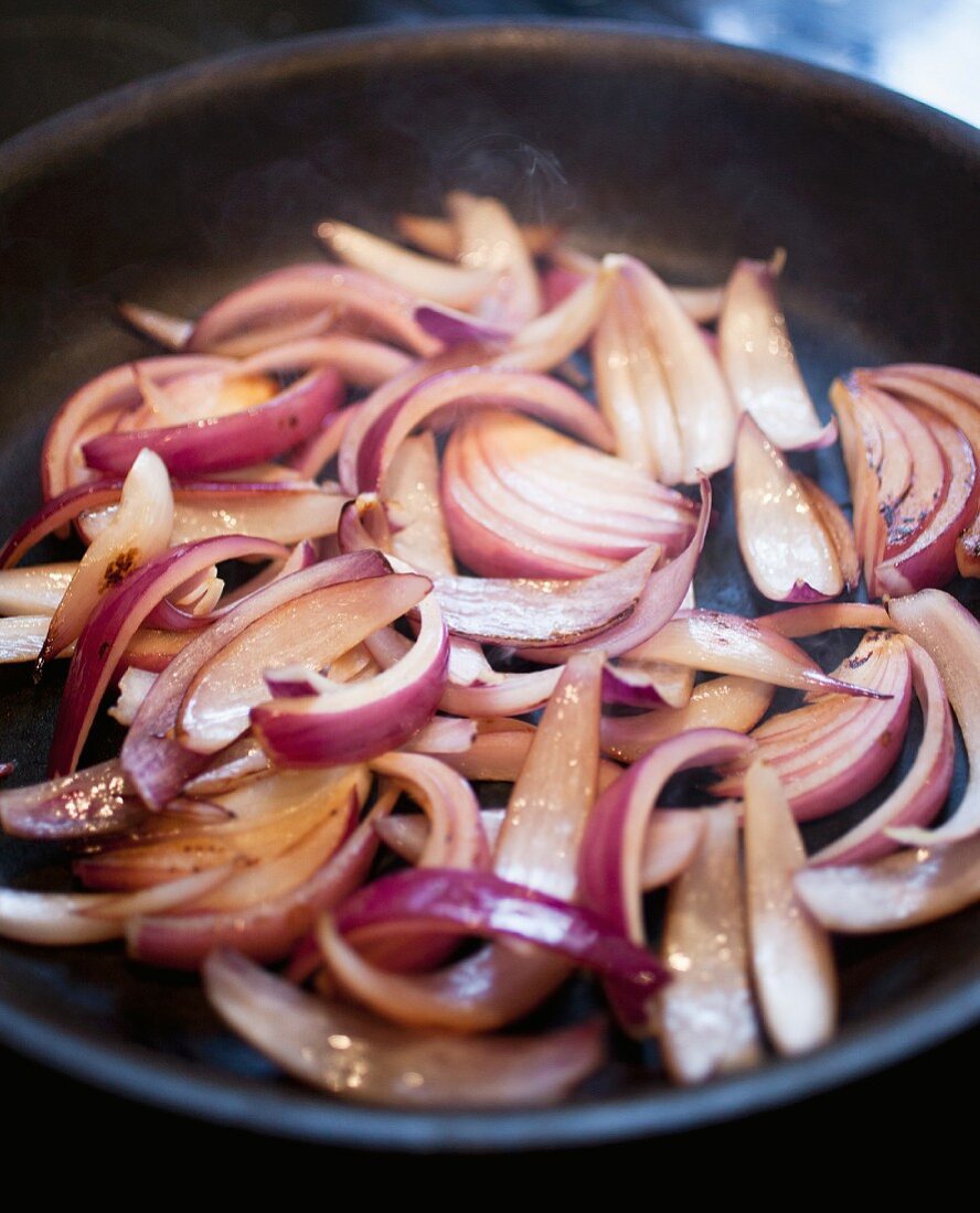 Sliced Red Onions Cooking in a Skillet