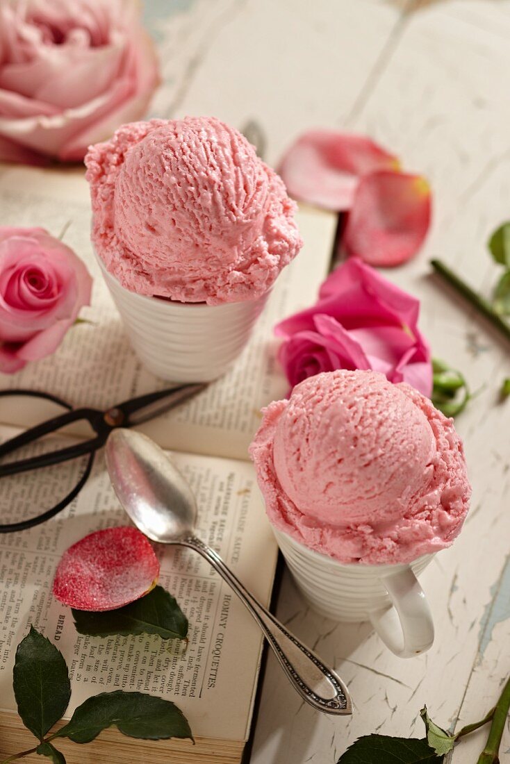 Two Cups of Rose Ice Cream with Fresh Roses; An Open Book, Spoon and Scissors