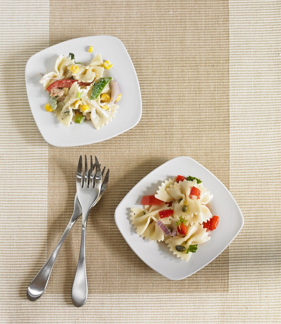 Two Plates of Pasta Salad; Country Chicken and Tuscan; Both Made with Farfalle Pasta