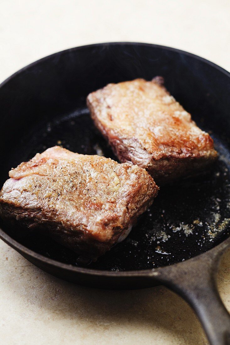 Beef Short Ribs in a Cast Iron Skillet
