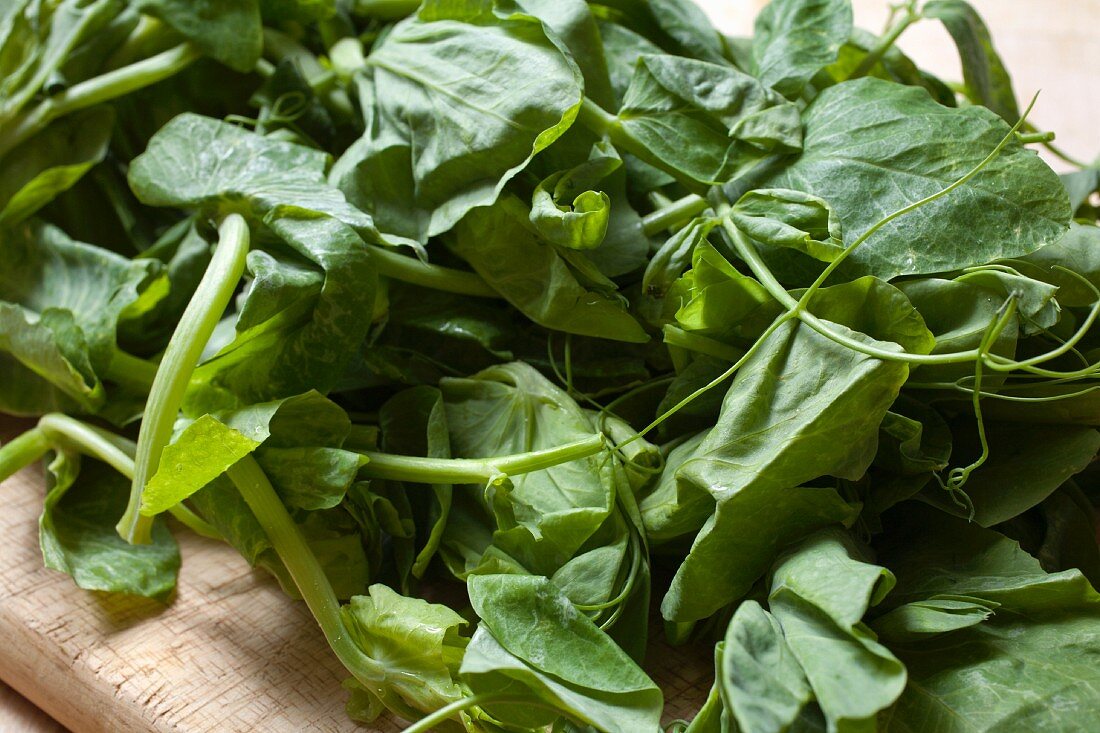 Fresh Pea Shoots on a Cutting Board