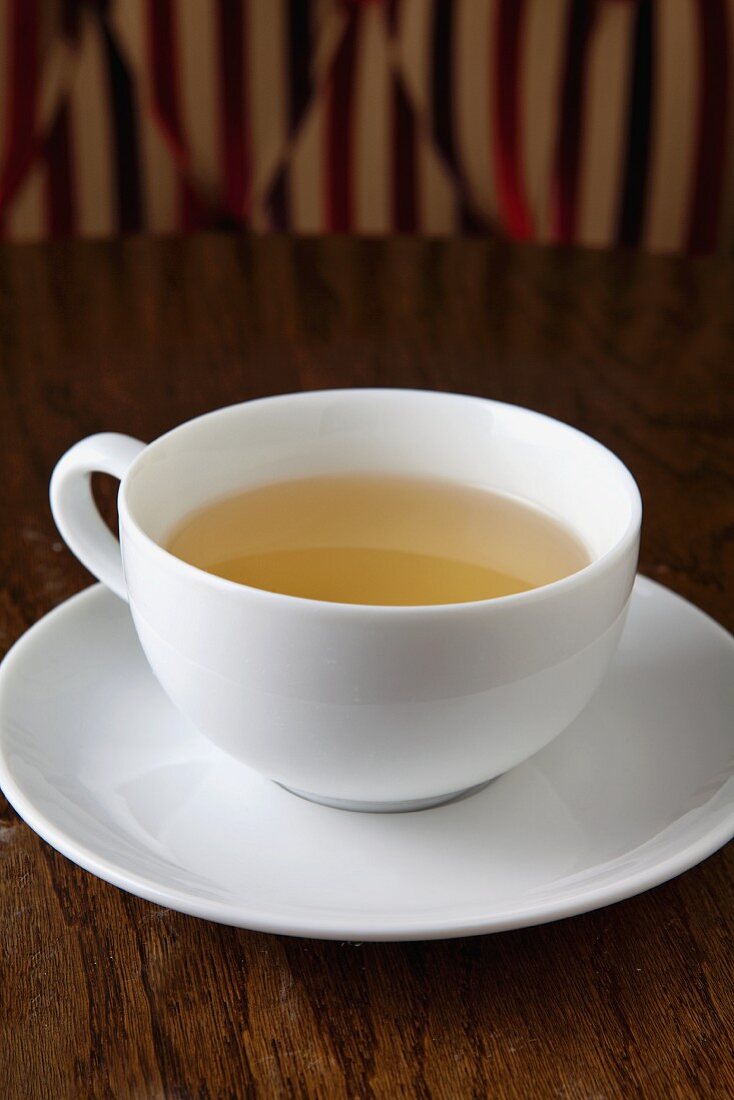 Cup of Green Tea on White