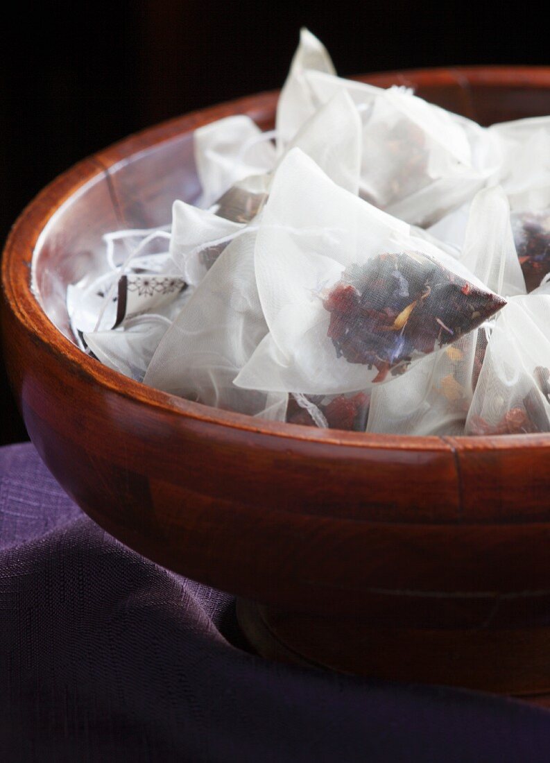 Handmade Tea Bags with Fruit, Flower and Berry Tea in a Wood Bowl