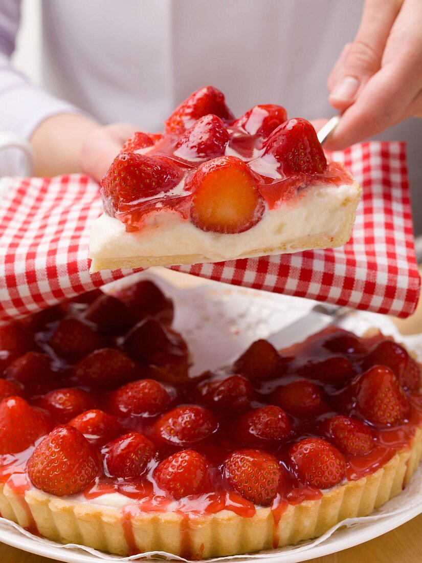 A piece of strawberry tart on a cake slice