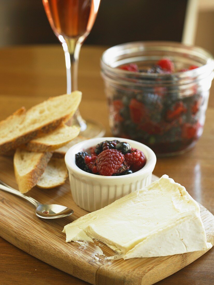 Cheese Wedge with Berry Compote and Bread Slices