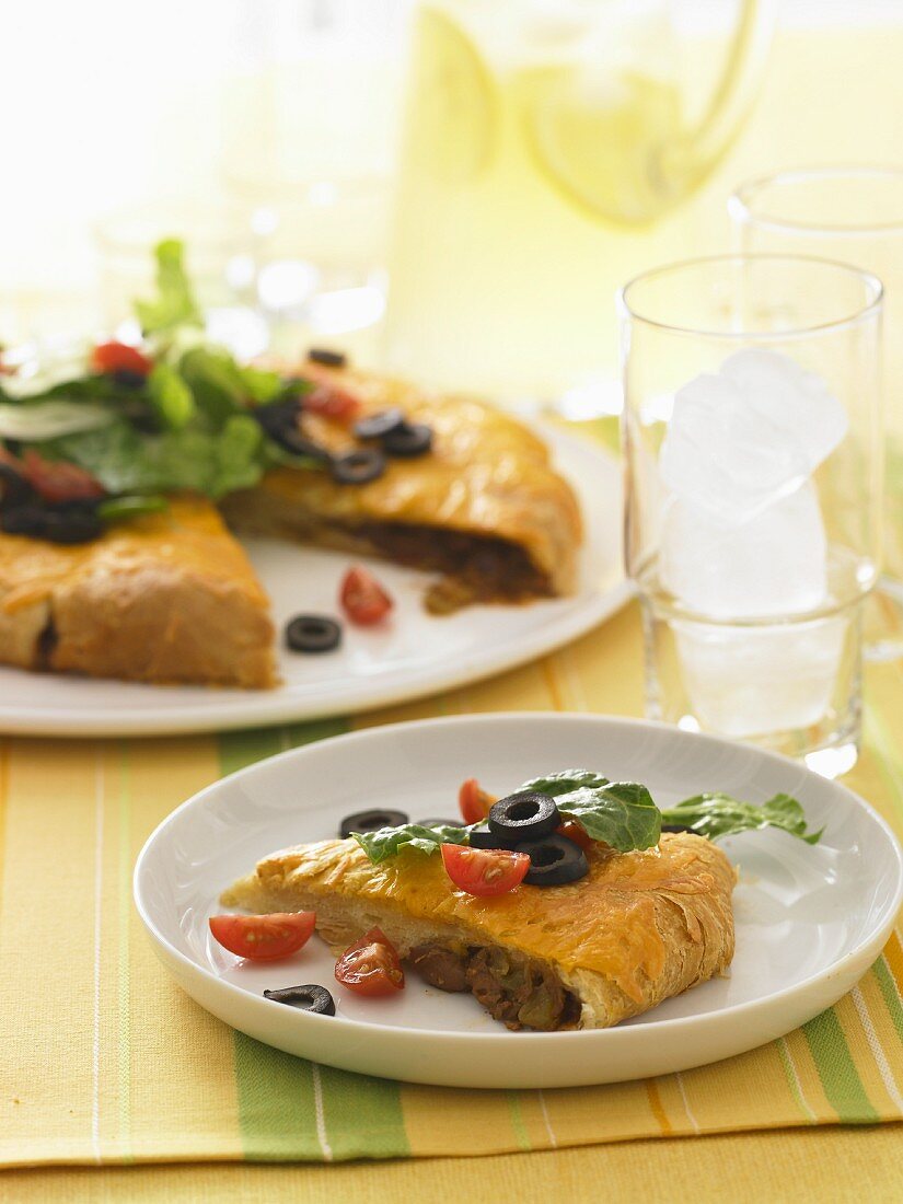 Slice of Empanada with Olives and Tomato
