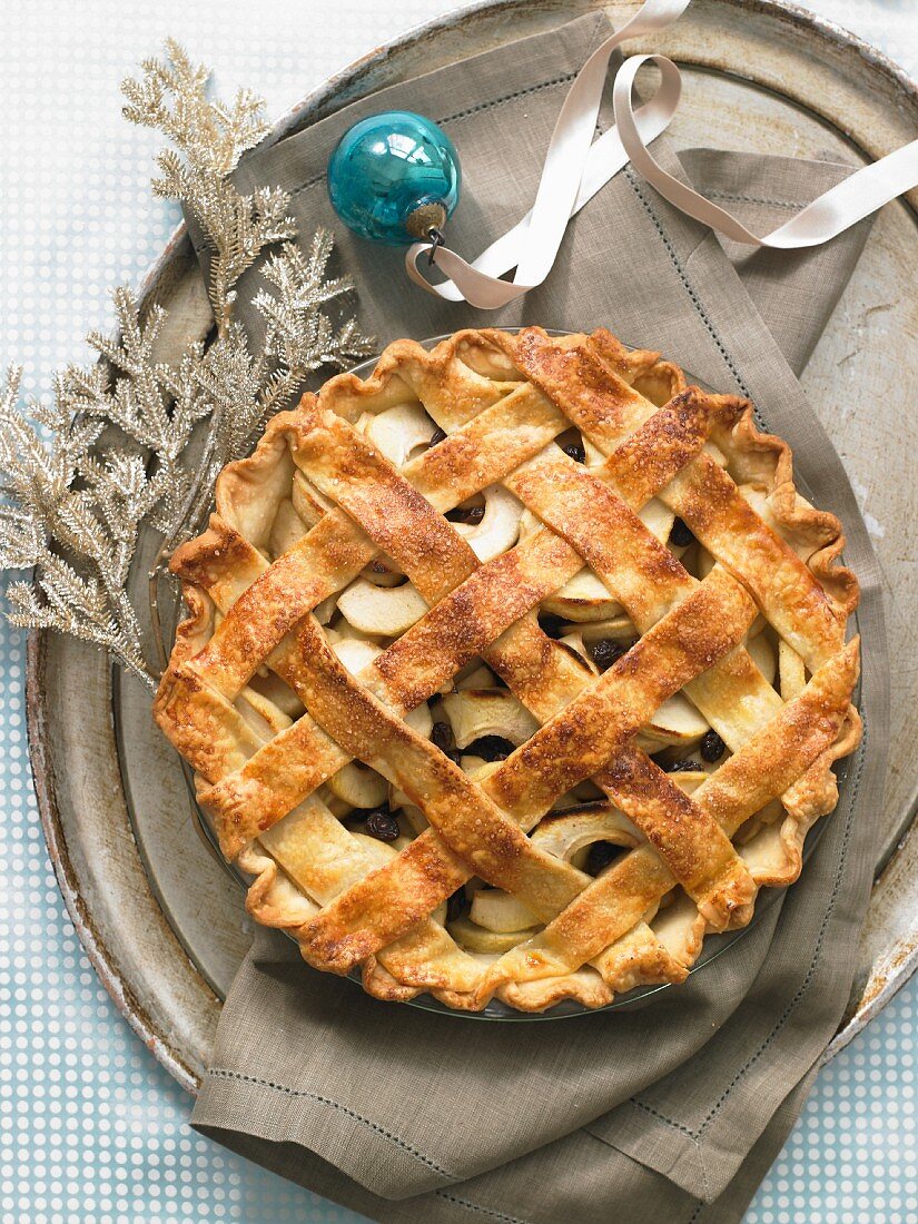 Whole Lattice Topped Apple Pie on a Tray with Blue Christmas Ornament