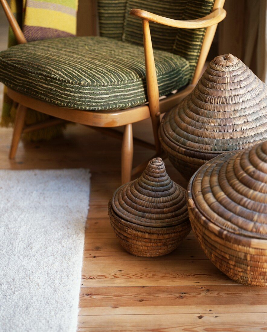 Set of baskets next to 50s-style armchair