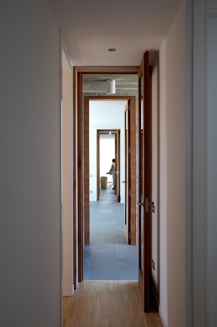 View through row of narrow, open doors
