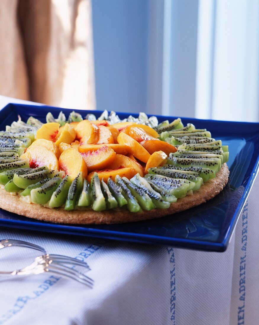 Fruit tart with kiwi and peach