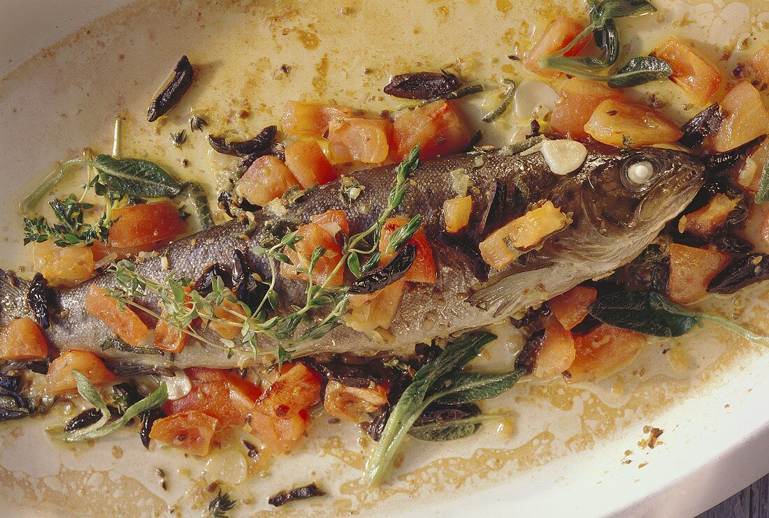 Mediterranean style trout with vegetables on a platter