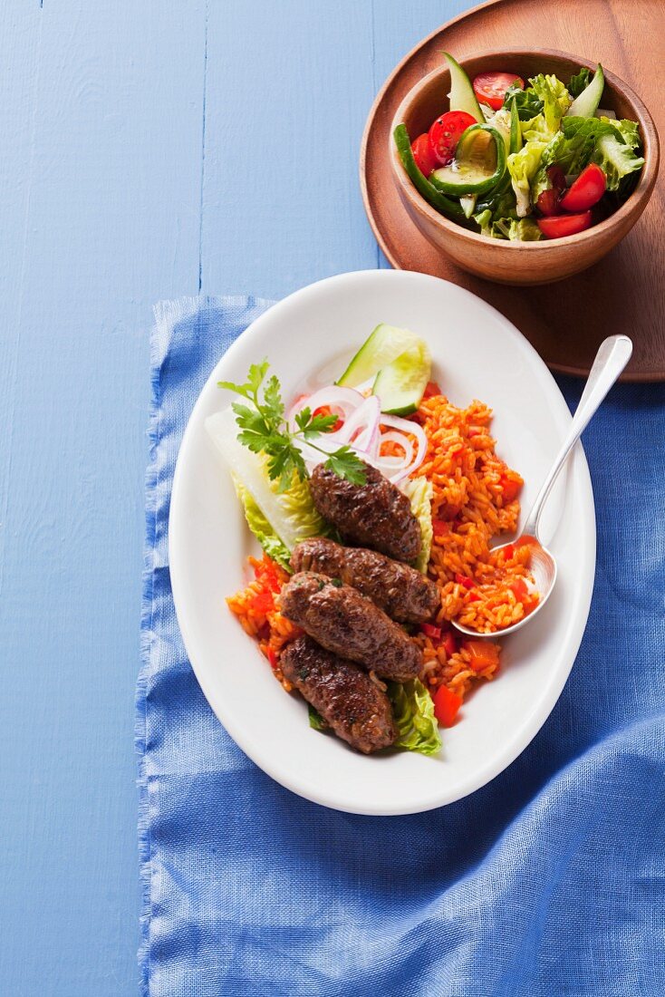 Cevapcici sausages with tomato rice