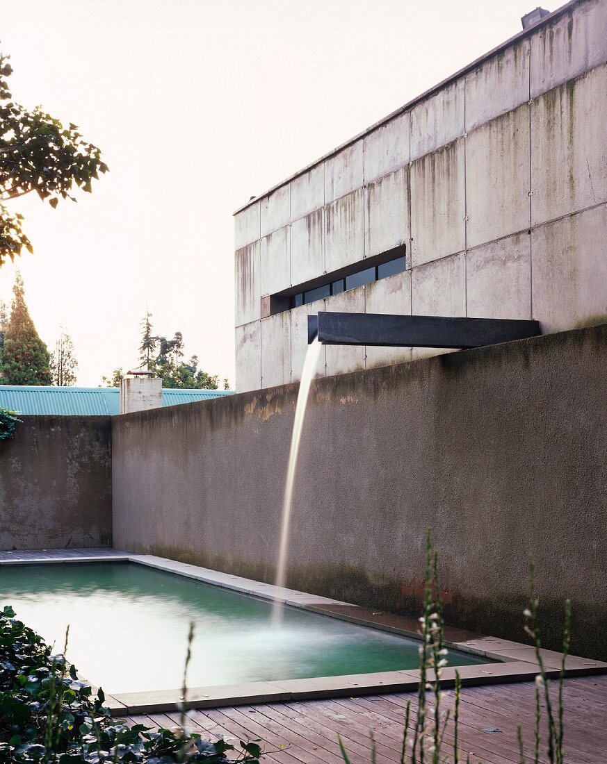 Swimming pool with small waterfall