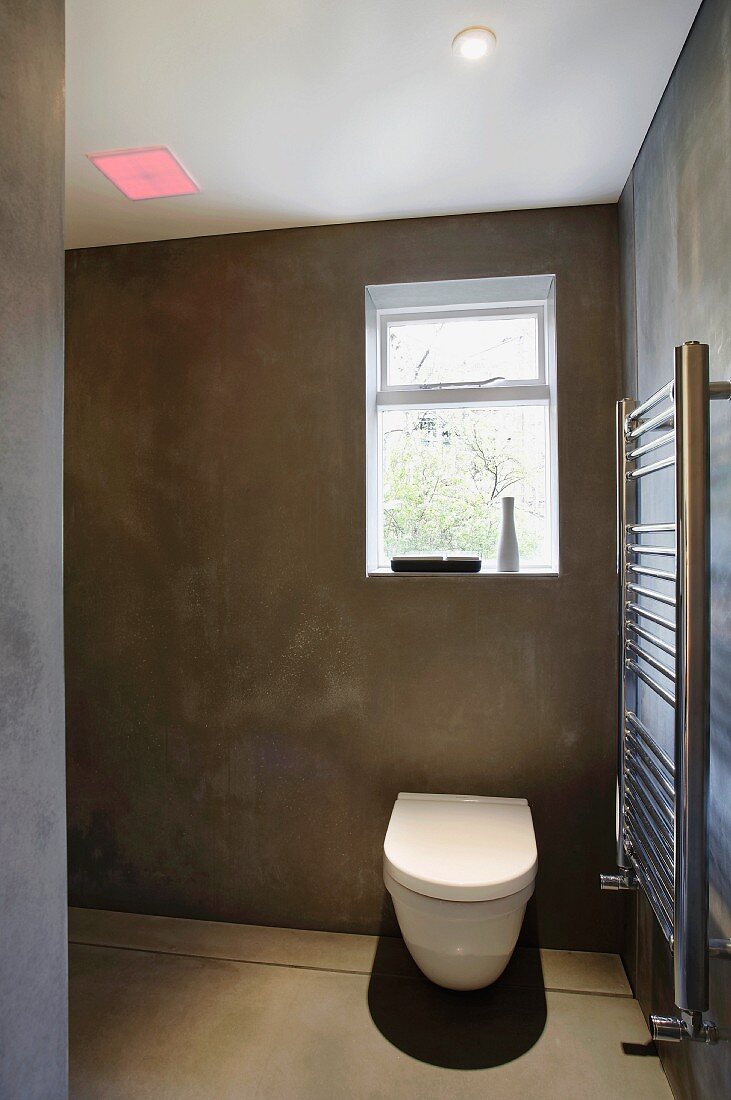 Bathroom with toilet and steel towel rail