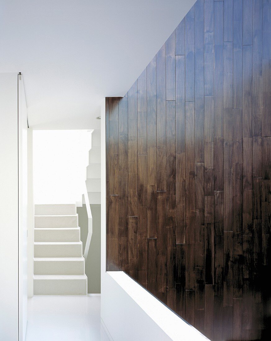 Wood-clad wall next to stairs