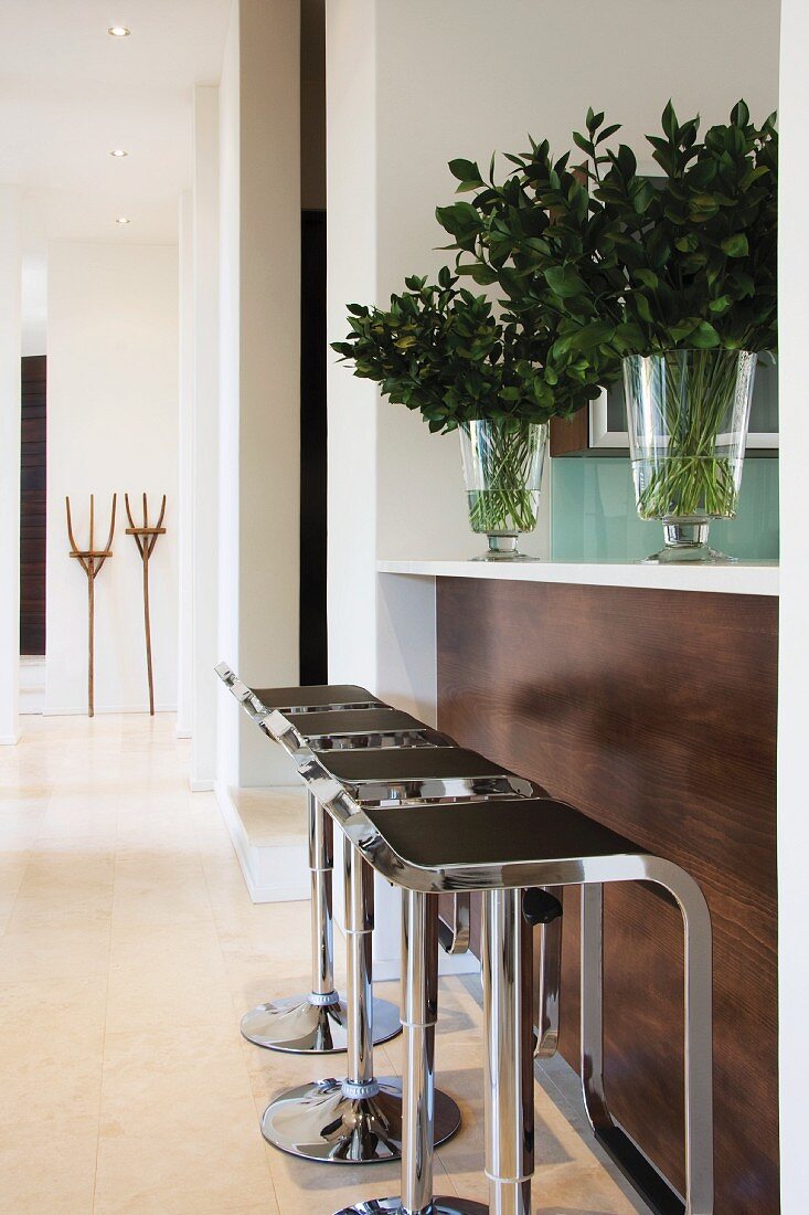 Adjustable 'Monaco' bar stools at a counter