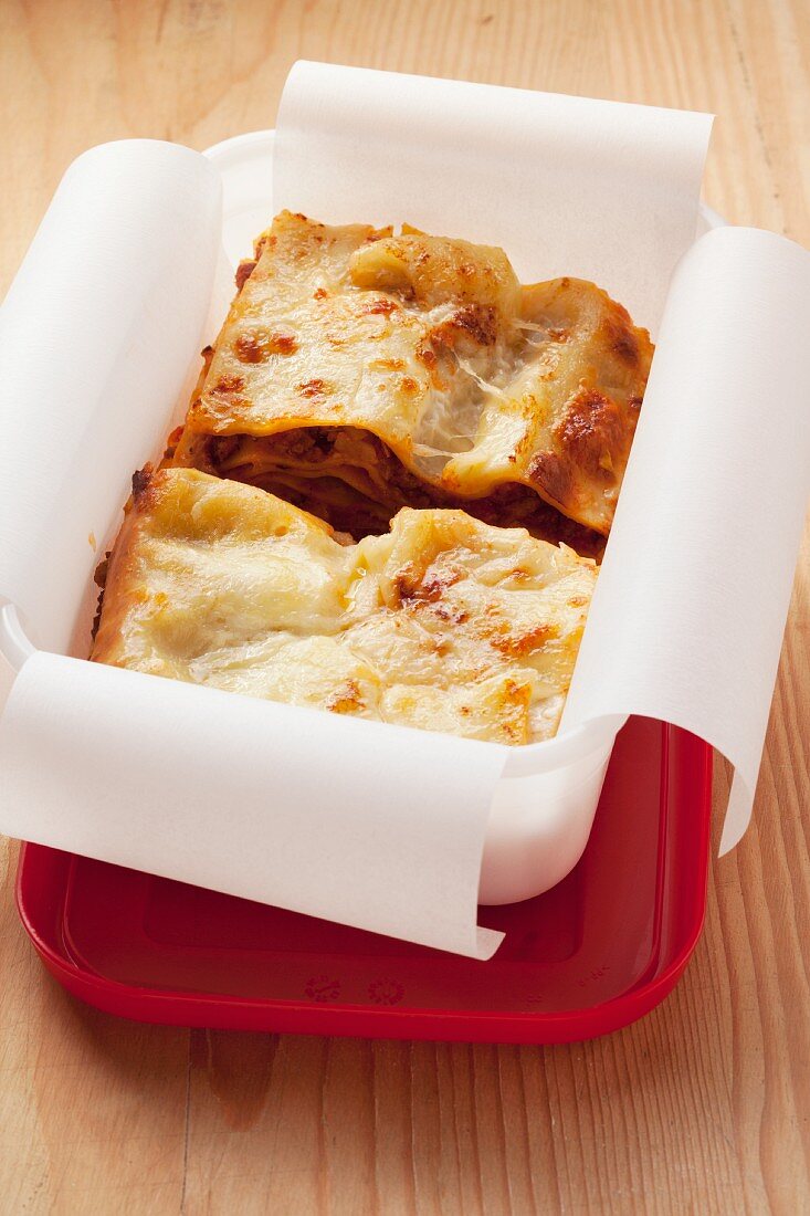 Lasagne stored in a plastic box