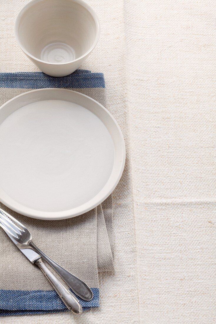 A beige coloured place setting