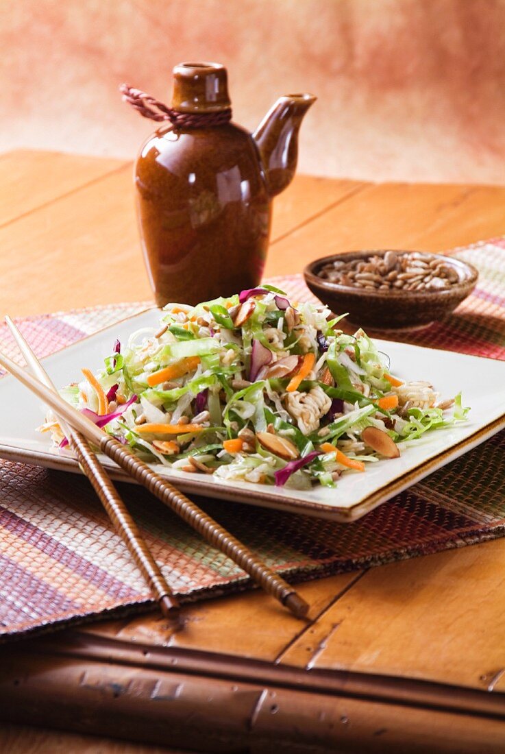 Asian Salad on a Square Dish with Chopsticks
