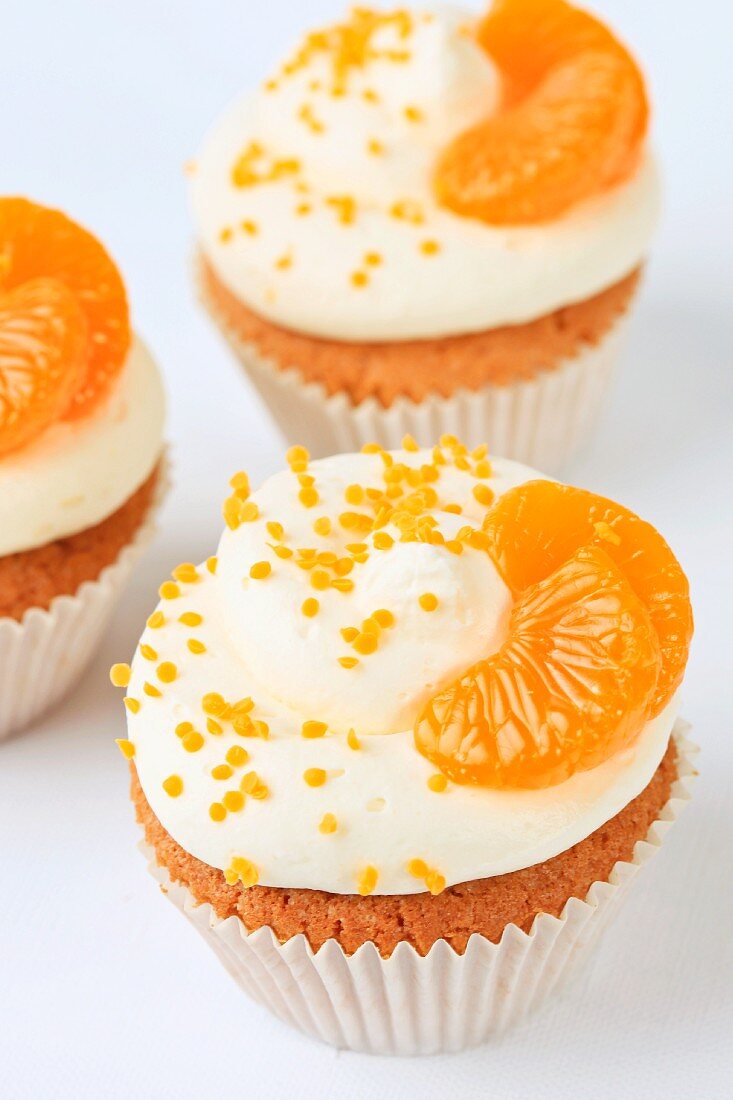 Cupcakes decorated with mandarins